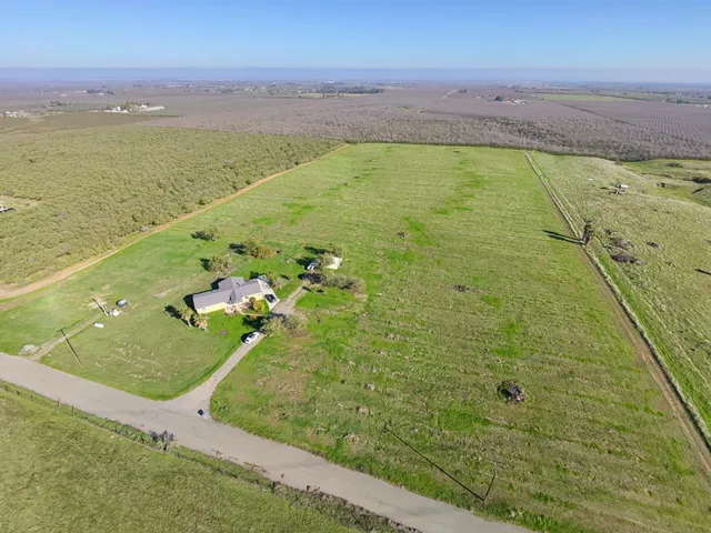 a view of a swimming pool with a yard
