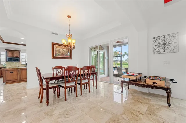 a view of a dining room with furniture window and outside view