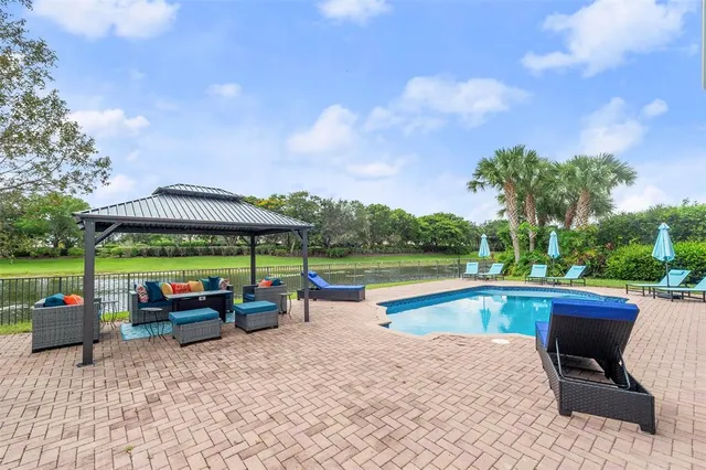 a view of a house with a yard porch and sitting area