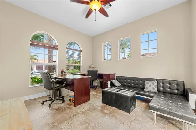 a bathroom with a granite countertop toilet and a sink