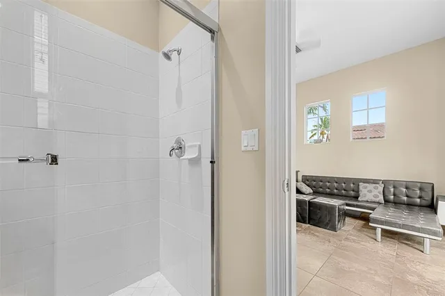 a view of a house with a backyard and a tree