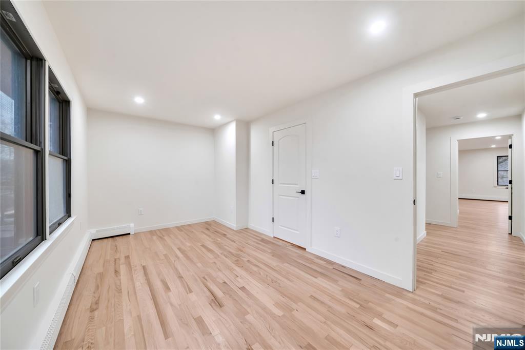 468 Morse Avenue Ridgefield, NJ 07657 - Photo 39 of 48 a view of a big room with wooden floor and a bathroom