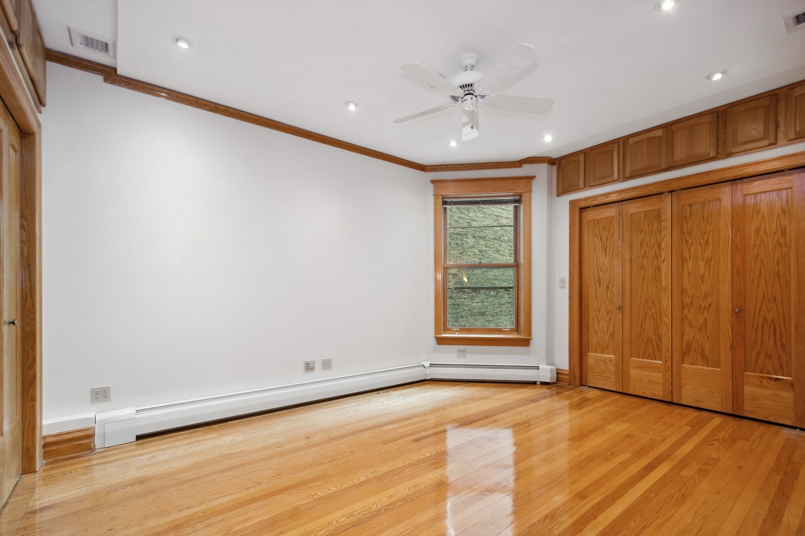 3631 North Sheffield Avenue, Unit 2 Chicago, IL 60613 - Photo 13 of 23 a view of an empty room with a window