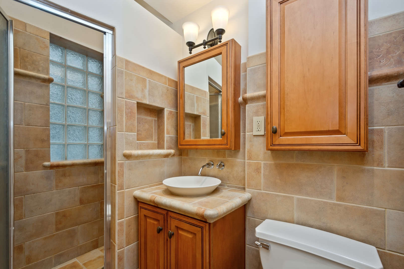 3631 North Sheffield Avenue, Unit 2 Chicago, IL 60613 - Photo 17 of 23 a bathroom with a sink toilet and shower
