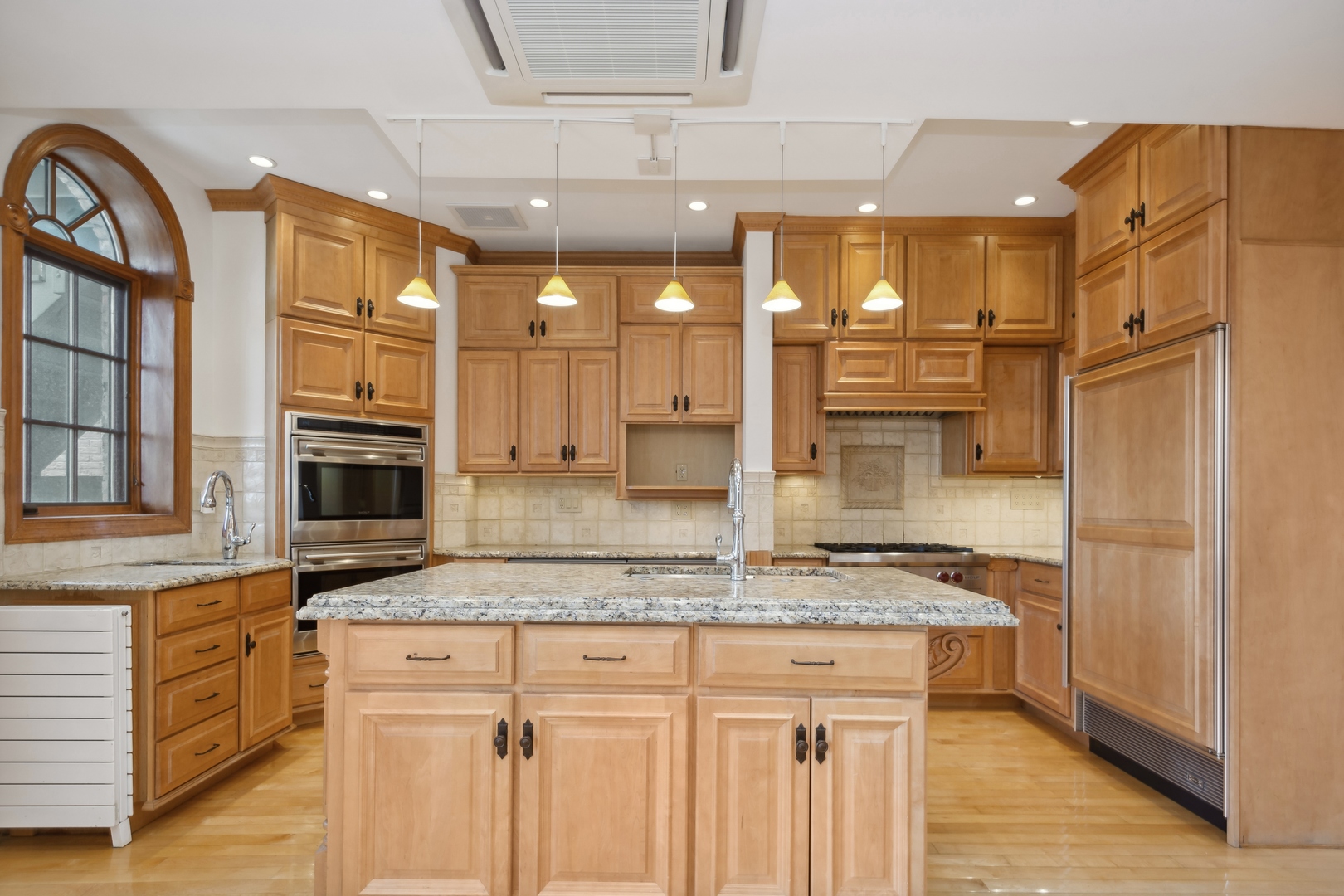 3631 North Sheffield Avenue, Unit 2 Chicago, IL 60613 - Photo 5 of 23 a kitchen with stainless steel appliances granite countertop a stove and a refrigerator