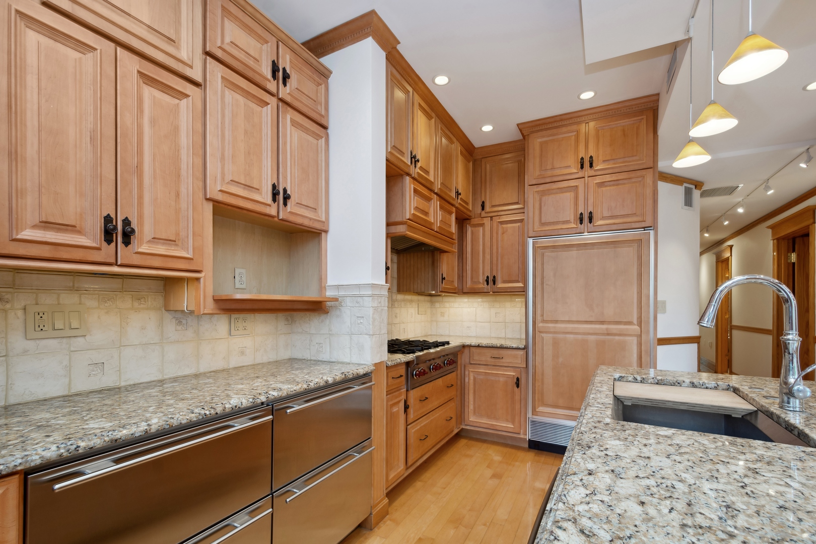 3631 North Sheffield Avenue, Unit 2 Chicago, IL 60613 - Photo 6 of 23 a kitchen with stainless steel appliances granite countertop a sink stove and cabinets