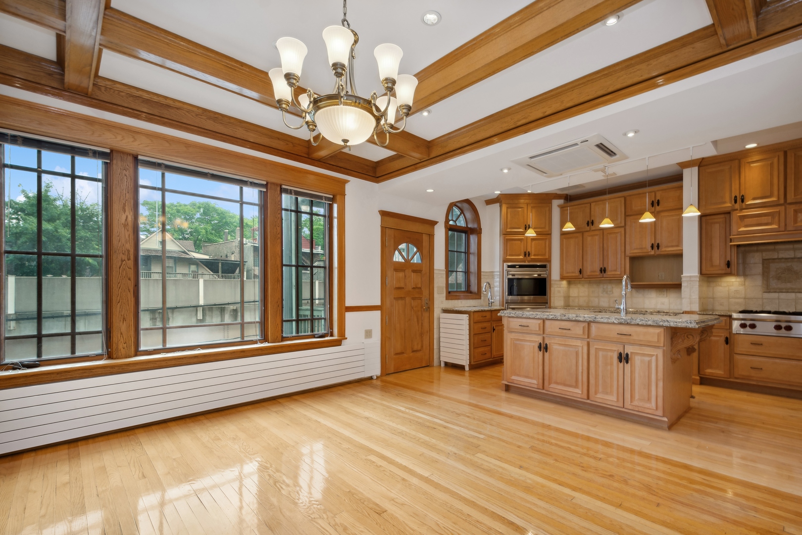 3631 North Sheffield Avenue, Unit 2 Chicago, IL 60613 - Photo 8 of 23 a large kitchen with stainless steel appliances granite countertop a large island in the center