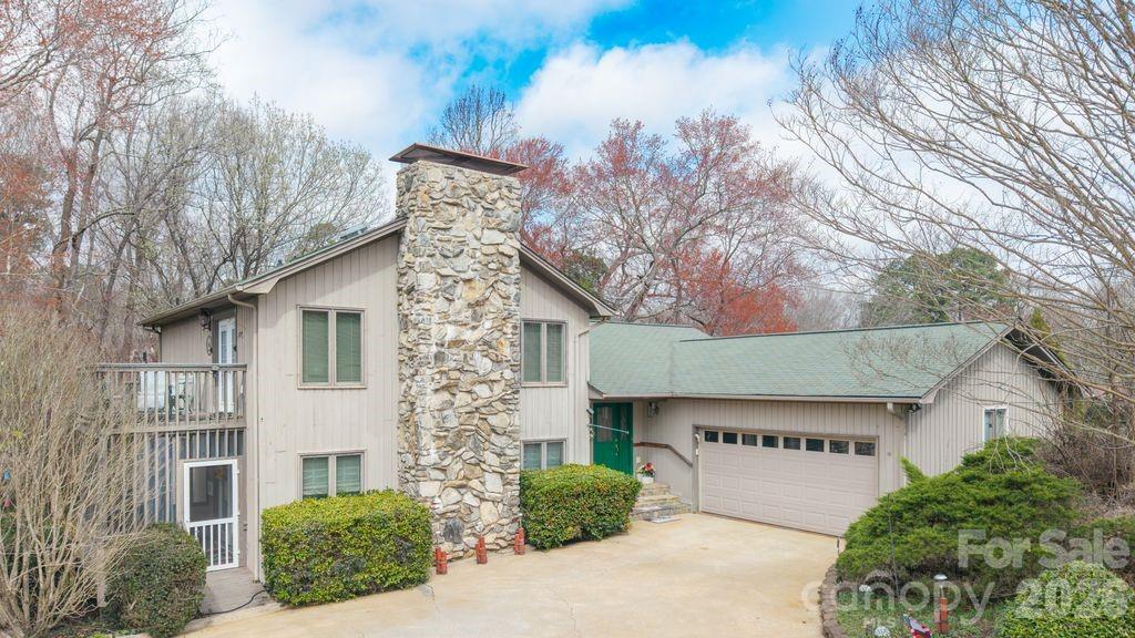 40 Old Field Road Taylorsville, NC 28681 - Photo 1 of 30 a front view of a house with garden