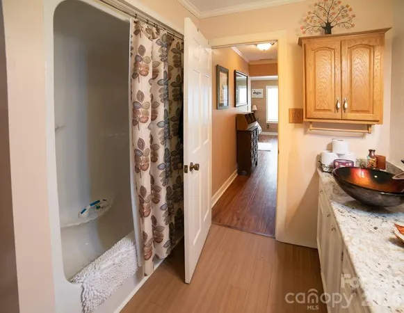 a bedroom with a bed and a television