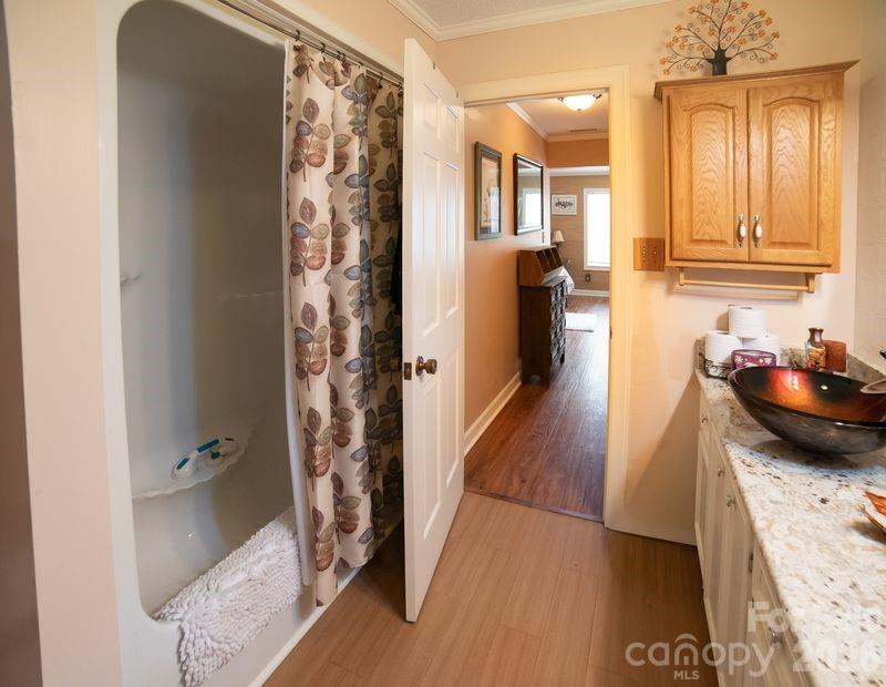 40 Old Field Road Taylorsville, NC 28681 - Photo 17 of 30 a kitchen with a sink and wooden floor
