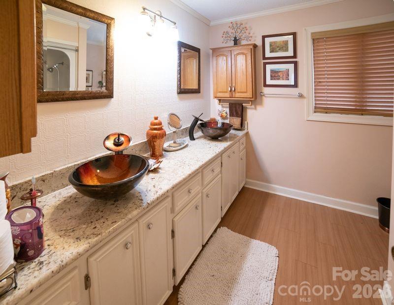 40 Old Field Road Taylorsville, NC 28681 - Photo 18 of 30 a bathroom with a granite countertop sink and a mirror