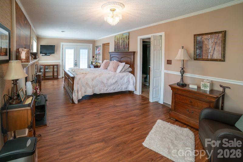 40 Old Field Road Taylorsville, NC 28681 - Photo 20 of 30 a bedroom with furniture and wooden floor
