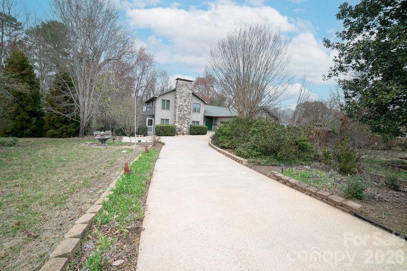 40 Old Field Road Taylorsville, NC 28681 - Photo 2 of 30 a view of a white house with a yard and large trees