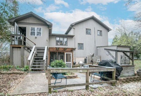 a view of a backyard with wooden fence