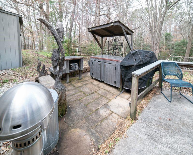 40 Old Field Road Taylorsville, NC 28681 - Photo 29 of 30 a backyard of a house with table and chairs