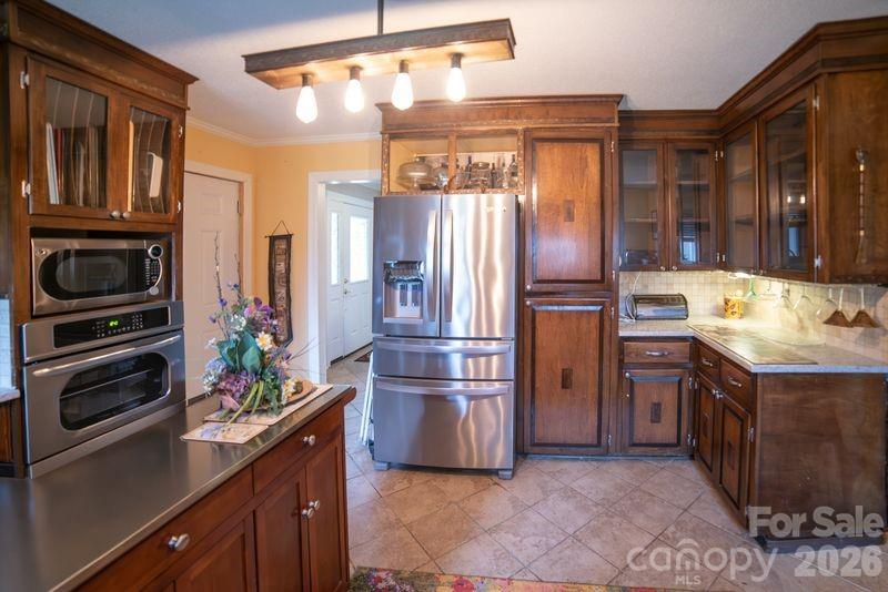 40 Old Field Road Taylorsville, NC 28681 - Photo 8 of 30 a kitchen with stainless steel appliances granite countertop a refrigerator and a stove top oven