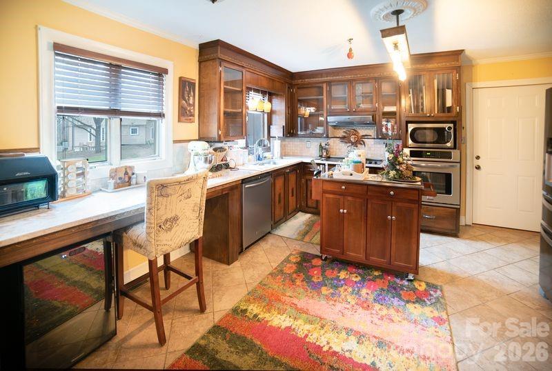 40 Old Field Road Taylorsville, NC 28681 - Photo 10 of 30 a large kitchen with kitchen island granite countertop wooden cabinets and stainless steel appliances