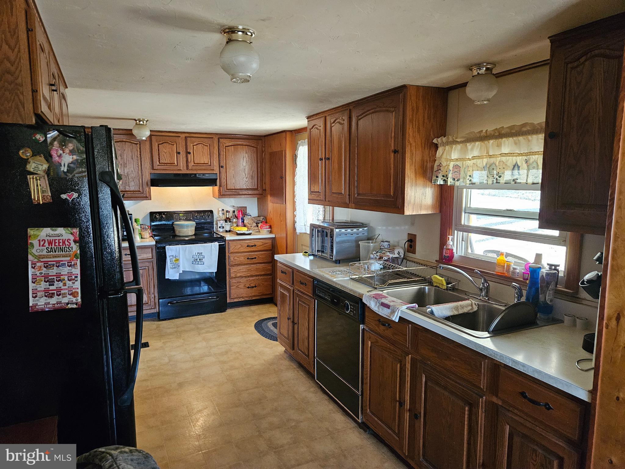 2165 Martin Road Spring Grove, PA 17362 - Photo 8 of 28 a kitchen with stainless steel appliances granite countertop a sink stove and refrigerator