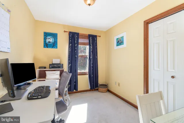 a view of a workspace with furniture