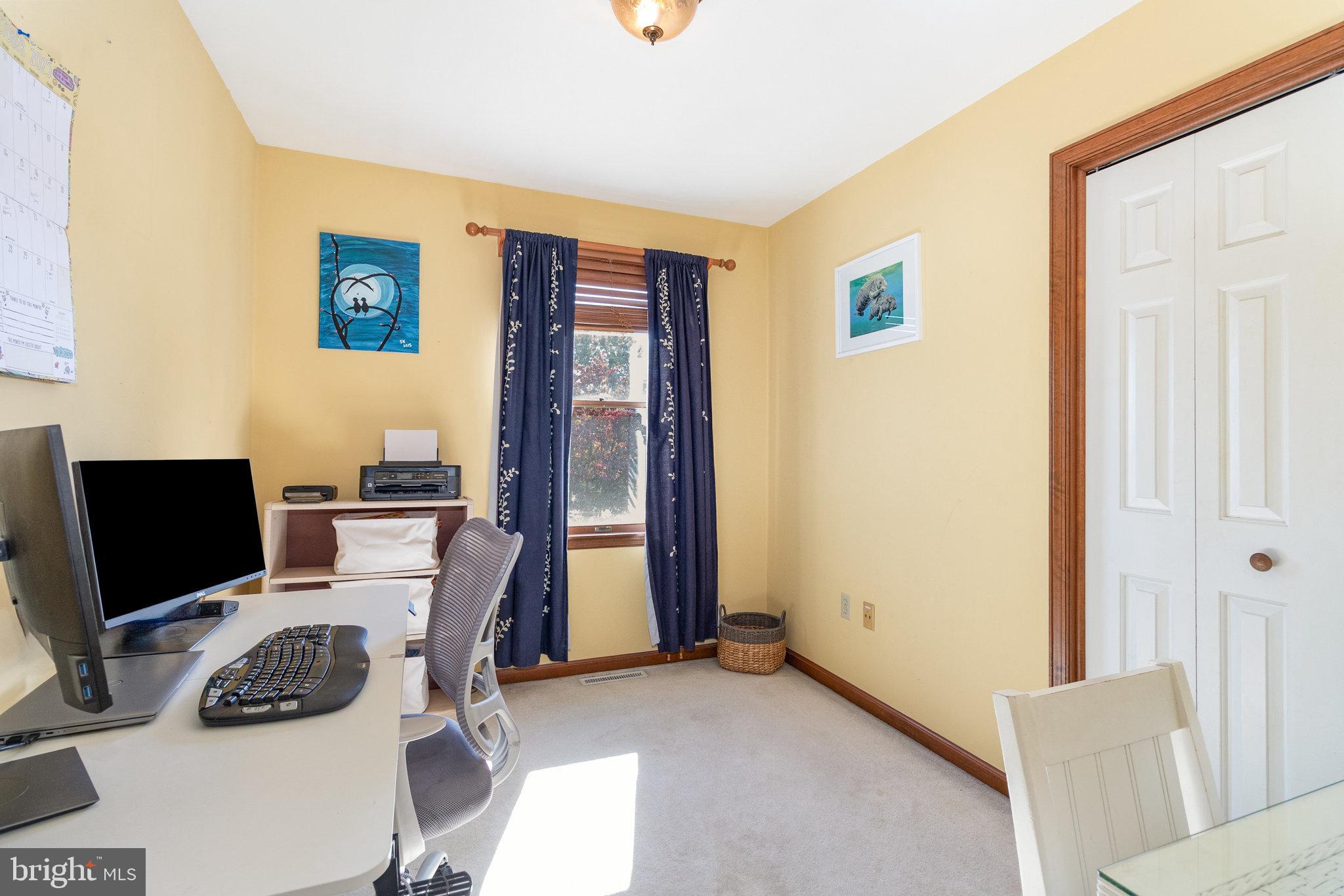6418 Taunton Road Harrisburg, PA 17111 - Photo 12 of 39 a bedroom with a bed and a flat screen tv