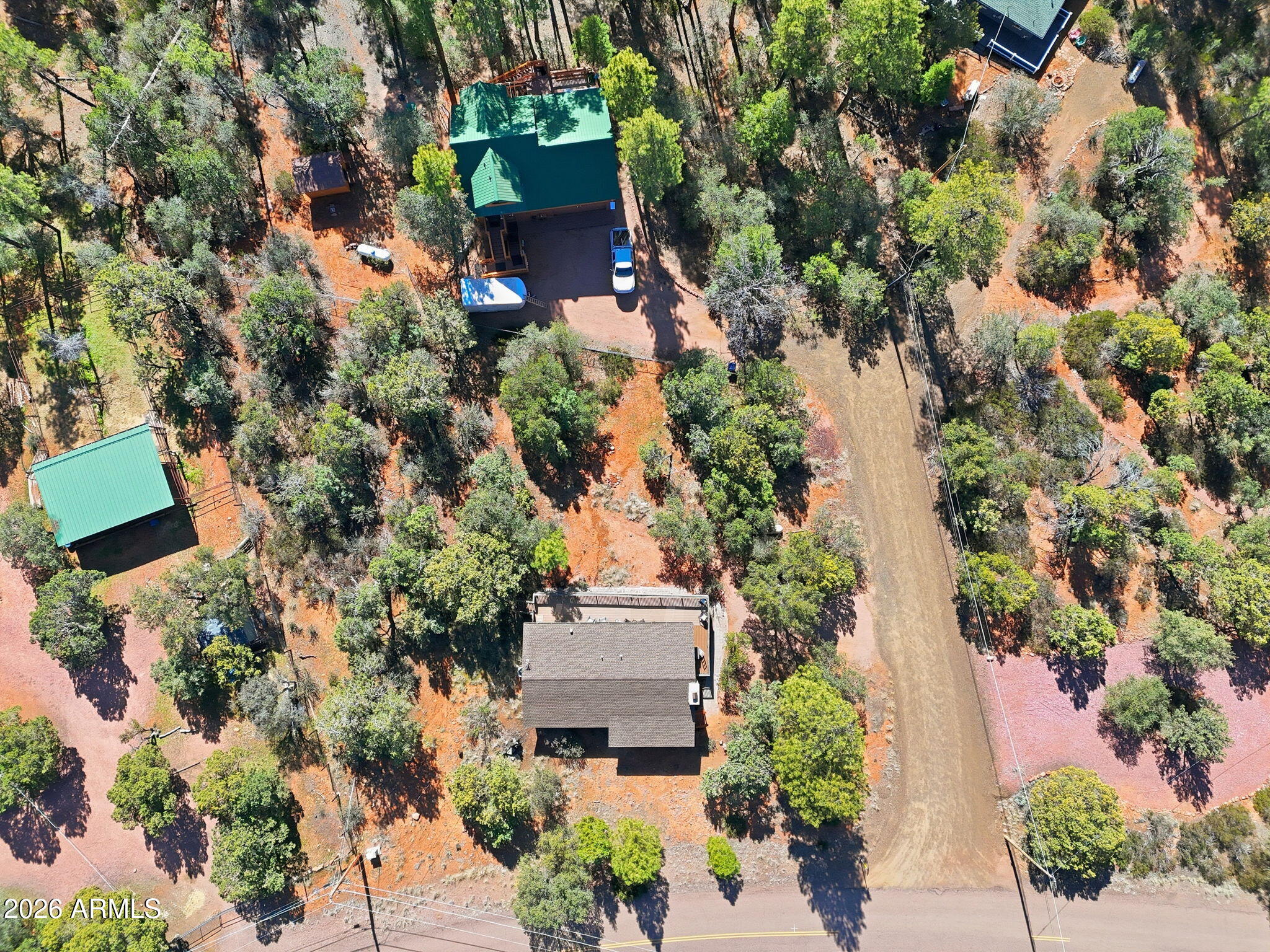 8247 Ralls Drive Pine, AZ 85544 - Photo 34 of 50 an aerial view of a house with a yard and garden