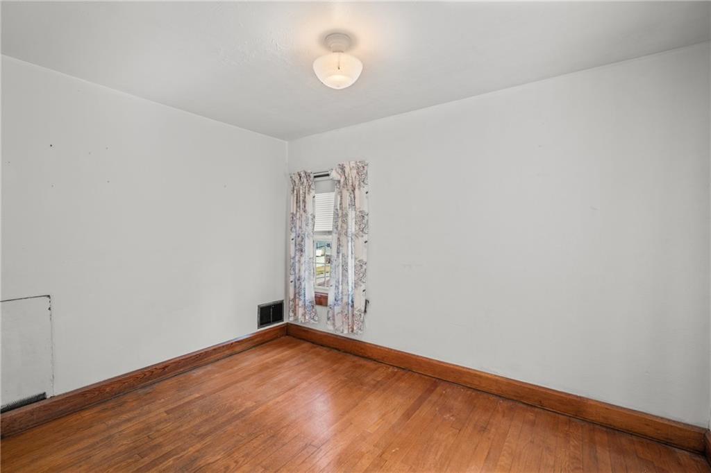 535 Oak Street Sharpsville, PA 16150 - Photo 13 of 19 a view of empty room with wooden floor and fan