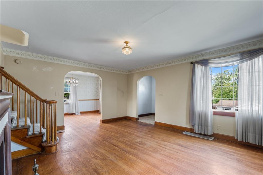 535 Oak Street Sharpsville, PA 16150 - Photo 3 of 19 a view of empty room with wooden floor and fan