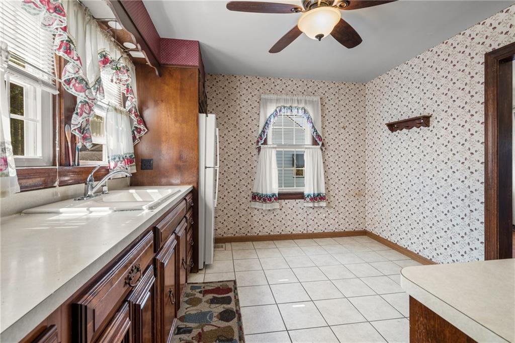 535 Oak Street Sharpsville, PA 16150 - Photo 5 of 19 a view of bathroom with a sink a mirror and shower