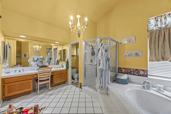 a bathroom with a sink a large mirror and a shower