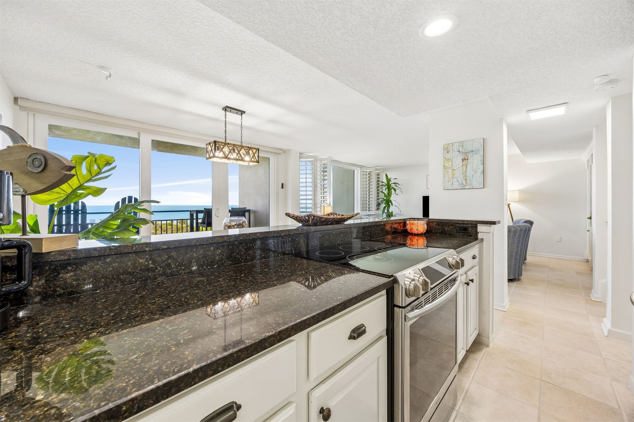 1119 Beach Walker Road, Unit 1119 Fernandina Beach, FL 32034 - Photo 17 of 32 a kitchen with stainless steel appliances granite countertop a stove a sink and a refrigerator
