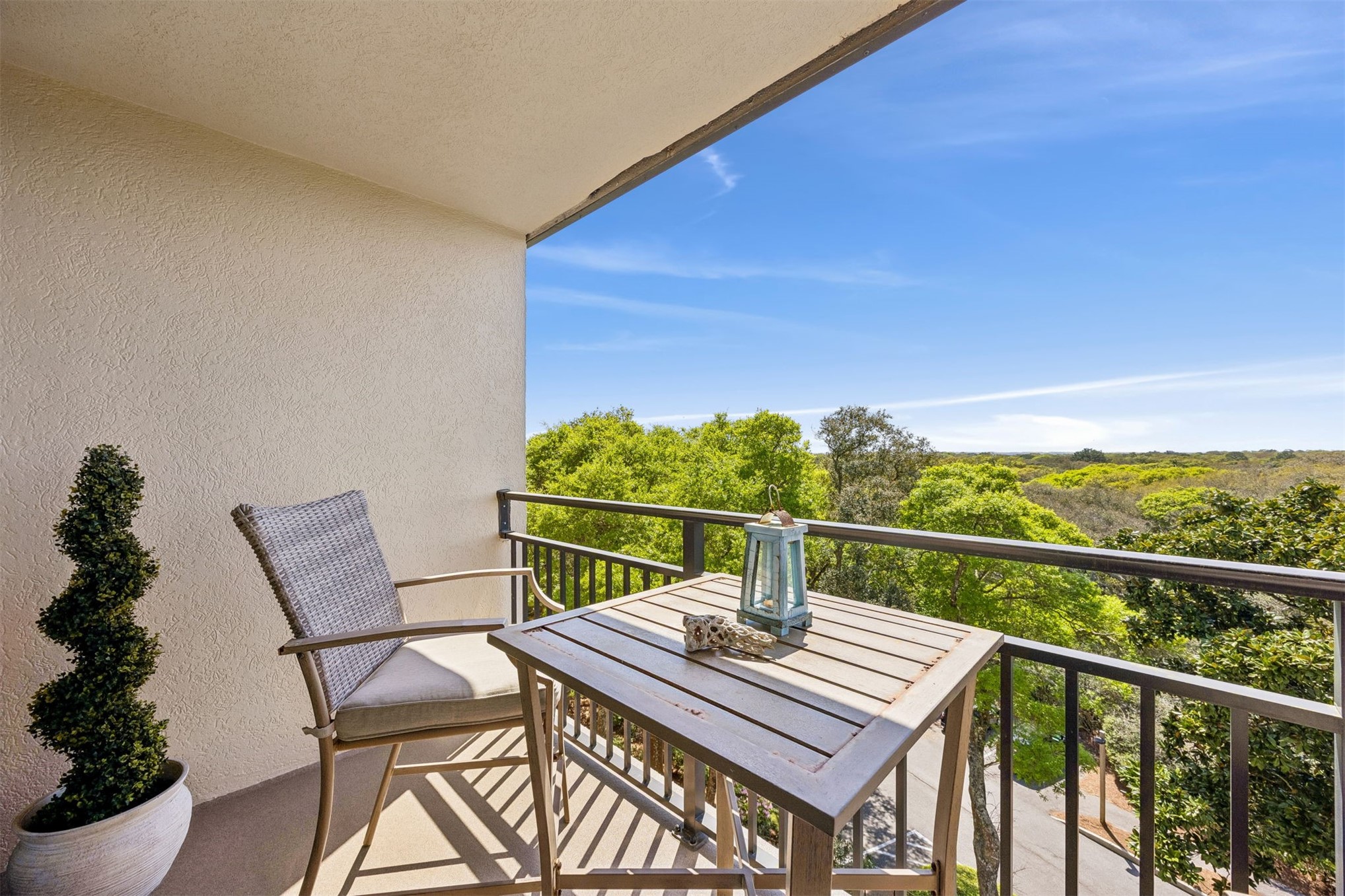 1119 Beach Walker Road, Unit 1119 Fernandina Beach, FL 32034 - Photo 7 of 32 a view of a balcony with dining table and chairs