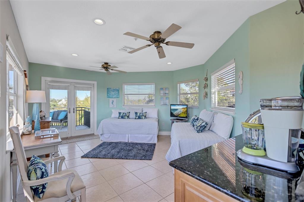 436 Canal Road, Unit A Sarasota, FL 34242 - Photo 63 of 94 a living room with furniture and a wooden floor