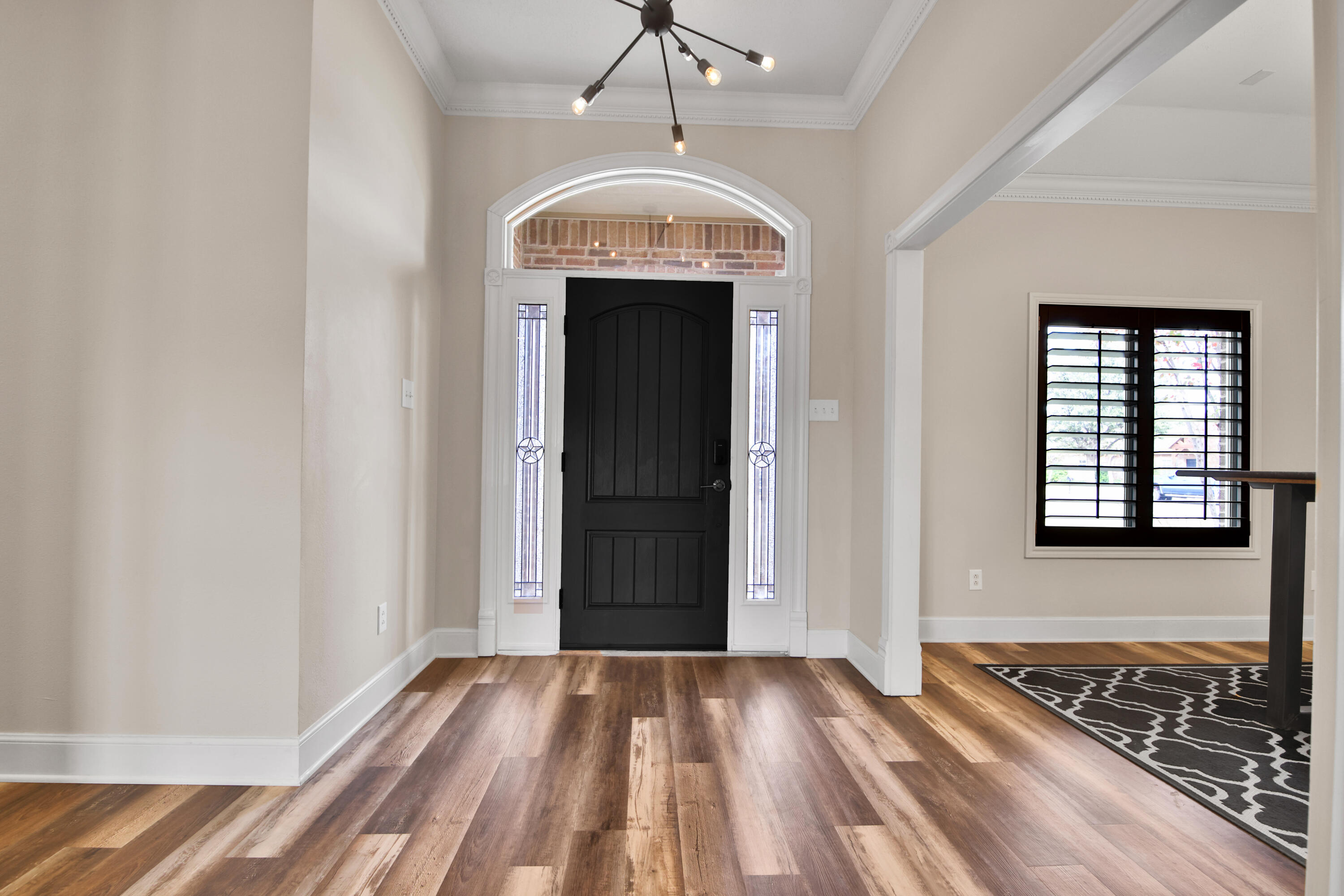4701 109th Place Lubbock, TX 79424 - Photo 13 of 42 wooden floor in an empty room with a window