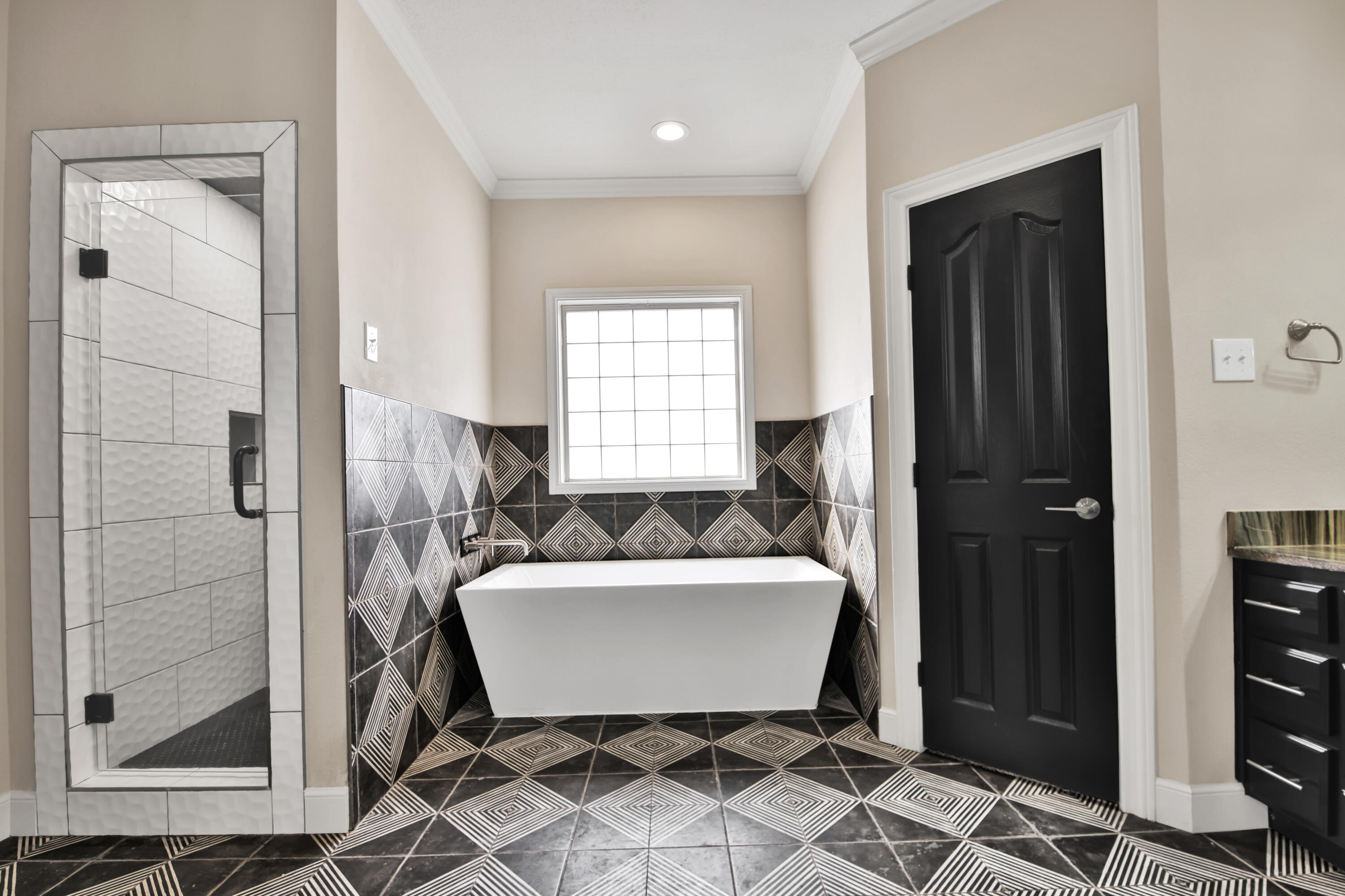 4701 109th Place Lubbock, TX 79424 - Photo 17 of 42 a bathroom with a bathtub and a shower
