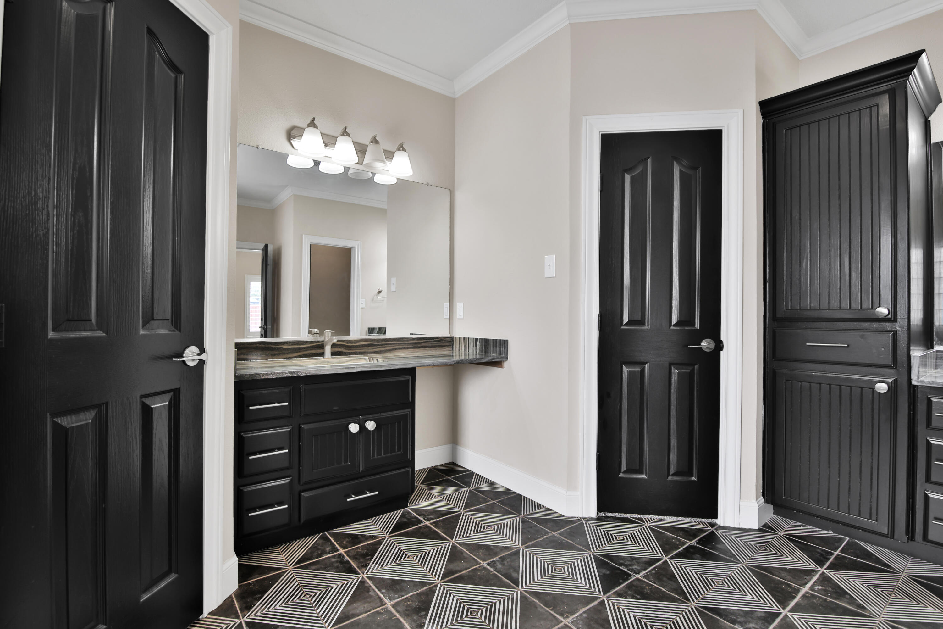 4701 109th Place Lubbock, TX 79424 - Photo 18 of 42 a room with a dresser and a chandelier