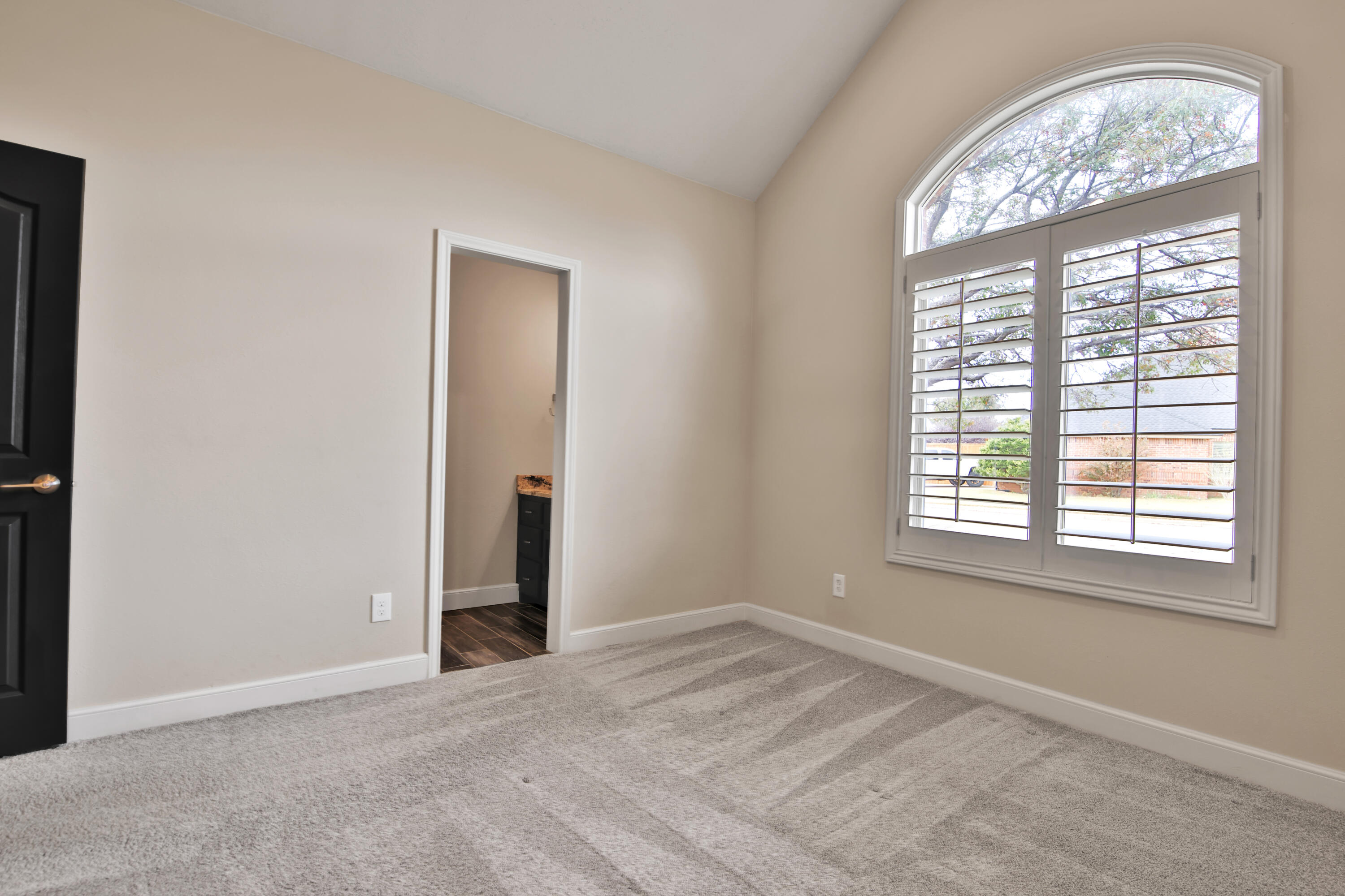 4701 109th Place Lubbock, TX 79424 - Photo 21 of 42 an empty room with a large window