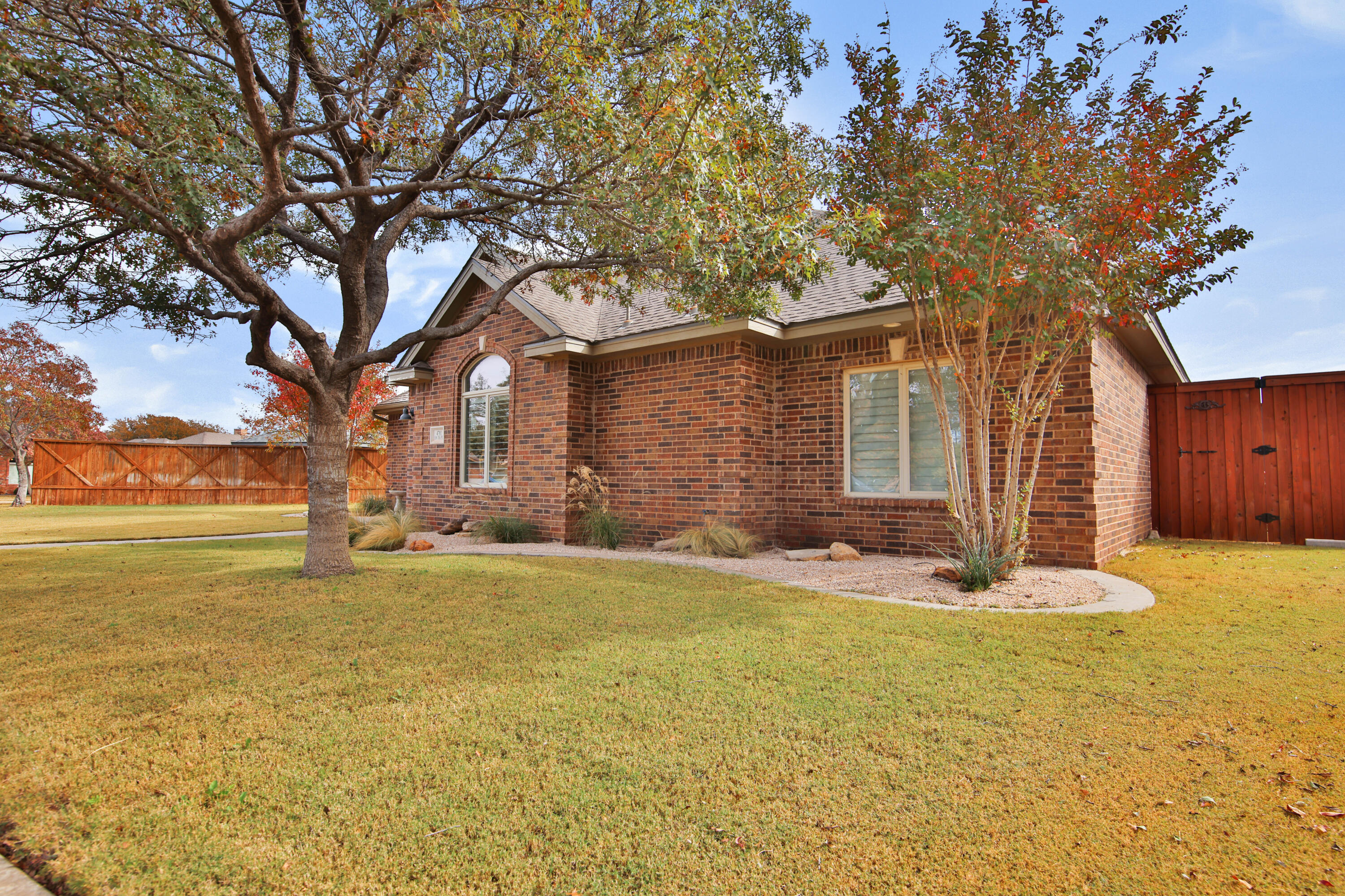 4701 109th Place Lubbock, TX 79424 - Photo 4 of 42 a house with trees in front of it