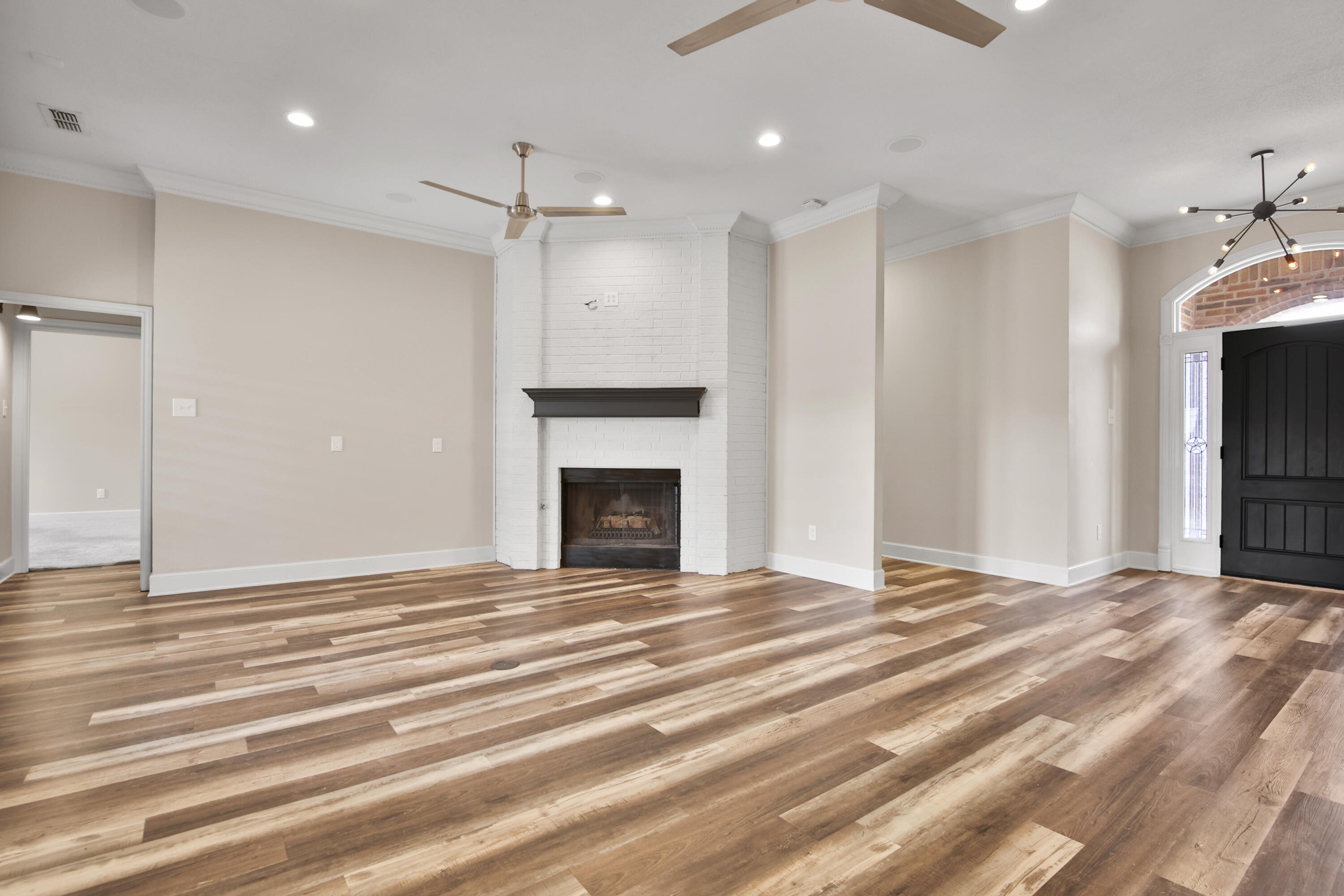 4701 109th Place Lubbock, TX 79424 - Photo 8 of 42 a view of empty room with kitchen and fireplace