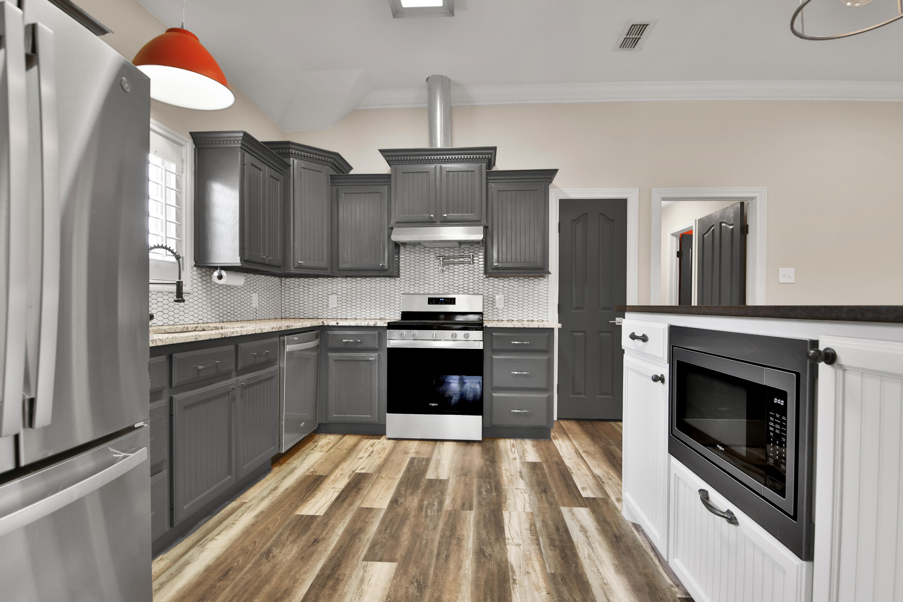 4701 109th Place Lubbock, TX 79424 - Photo 10 of 42 a kitchen with a stove a refrigerator and a sink