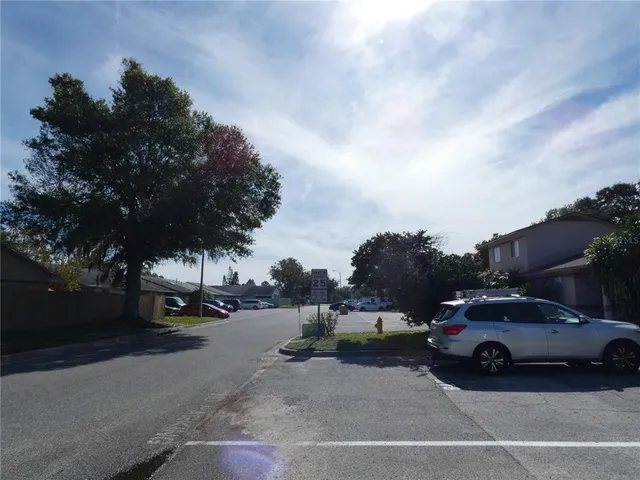 a view of street with parked cars