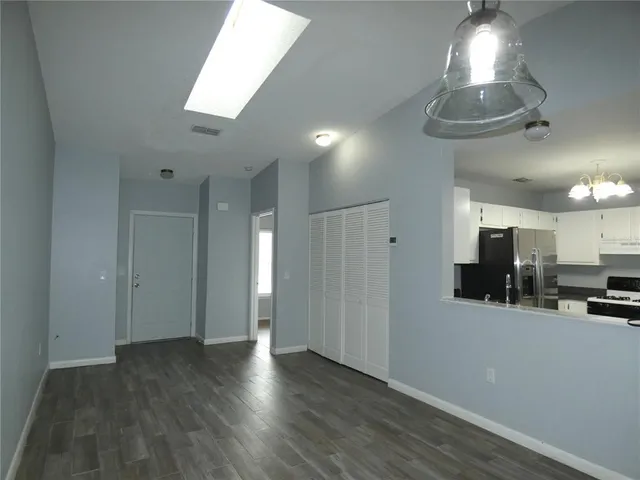 a view of a kitchen with furniture and a window