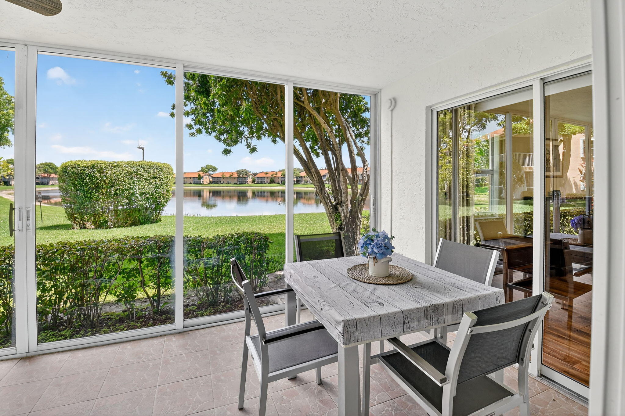 9877 Seacrest Circle, Unit 101 Boynton Beach, FL 33437 - Photo 13 of 39 Glass Enclosed Patio