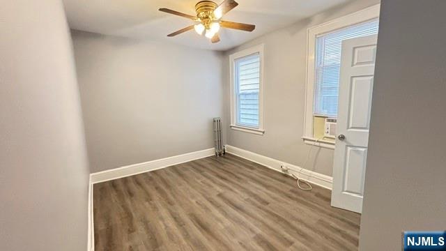 760 Hamilton Street, Unit 1 Harrison, NJ 07029 - Photo 10 of 23 wooden floor in an empty room with a window