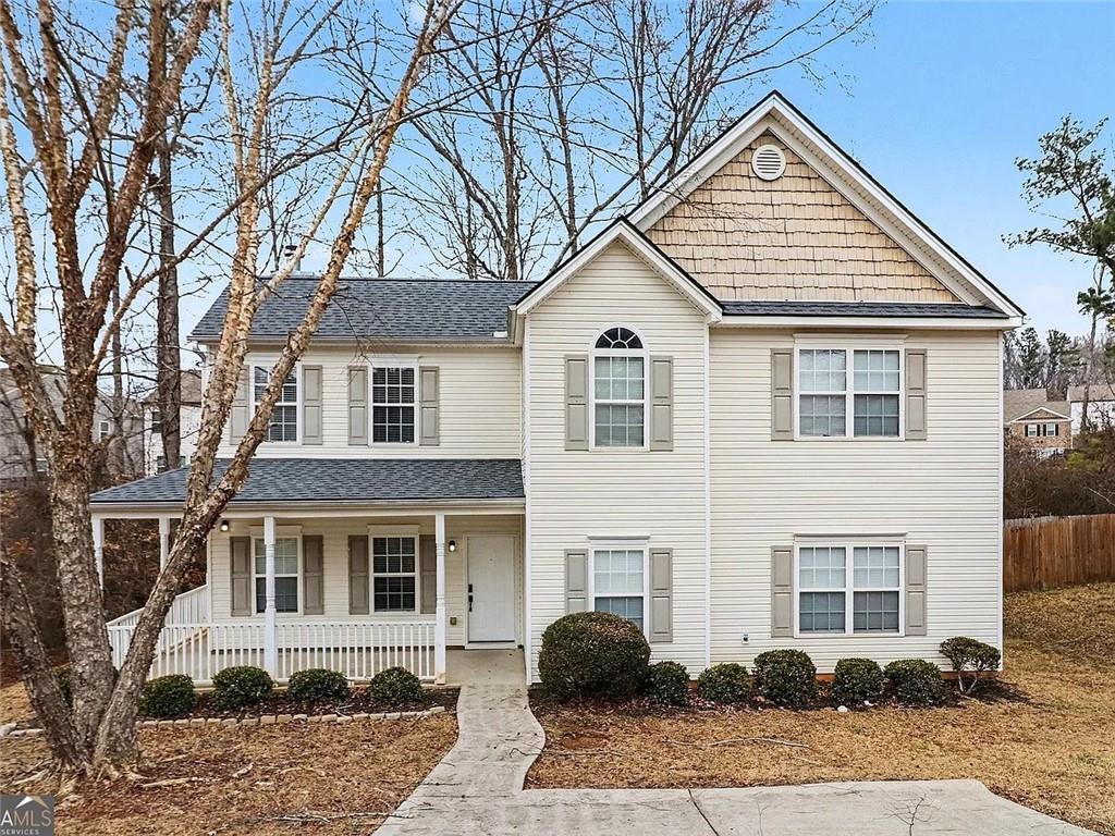 4108 Robin Circle Atlanta, GA 30349 - Photo 1 of 9 a front view of a house with garden