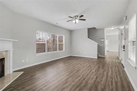 4108 Robin Circle Atlanta, GA 30349 - Photo 4 of 9 a view of an empty room with wooden floor and a window