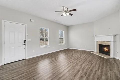 4108 Robin Circle Atlanta, GA 30349 - Photo 7 of 9 a view of an empty room with a fireplace and a window