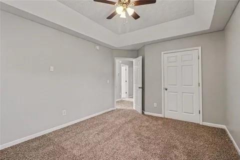 4108 Robin Circle Atlanta, GA 30349 - Photo 9 of 9 a view of an empty room and chandelier fan