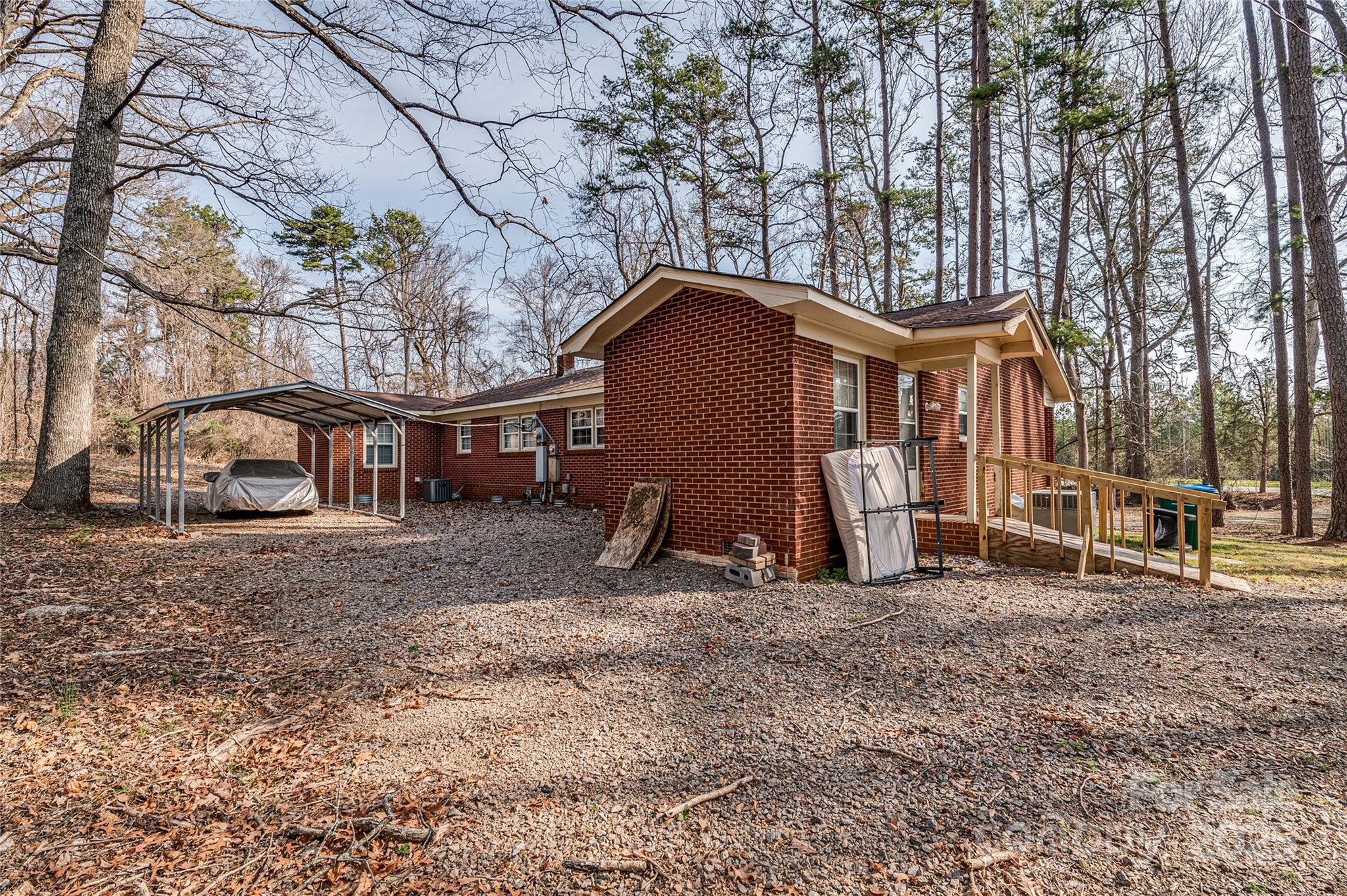 13216 Lawyers Road Mint Hill, NC 28227 - Photo 11 of 17 a view of a house with a yard and large tree