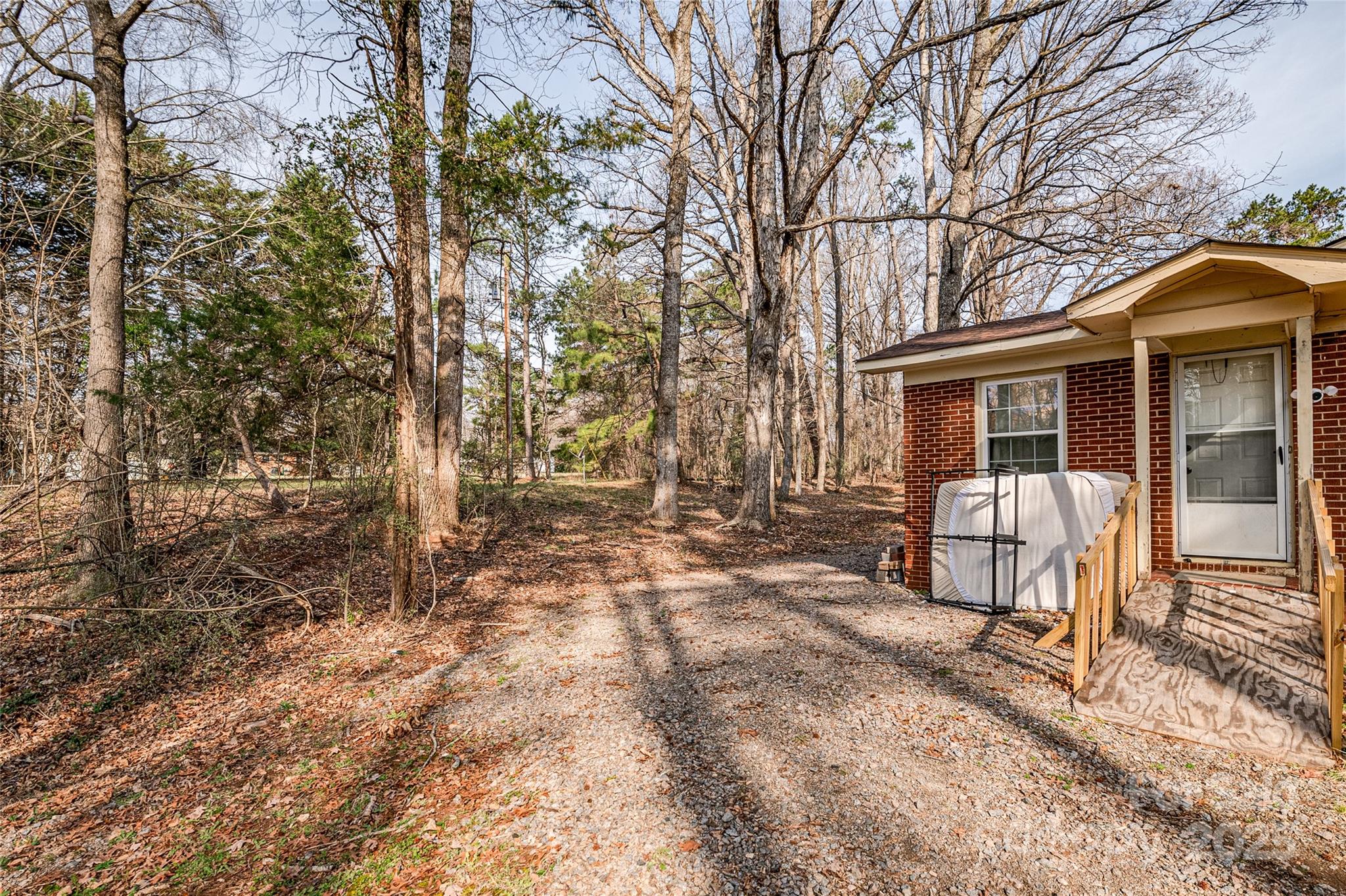 13216 Lawyers Road Mint Hill, NC 28227 - Photo 12 of 17 a view of a house with backyard and sitting area