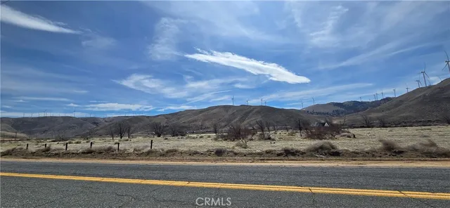 a view of a town with big trees
